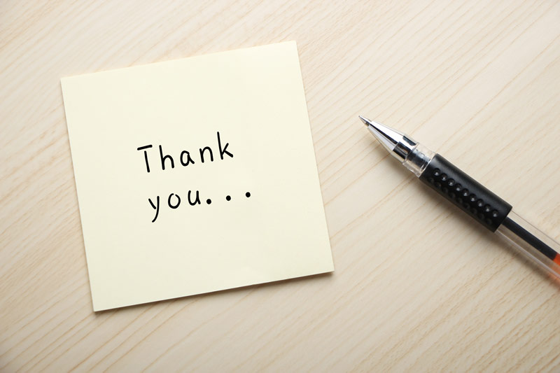 Sticky note that says thank you in handwriting